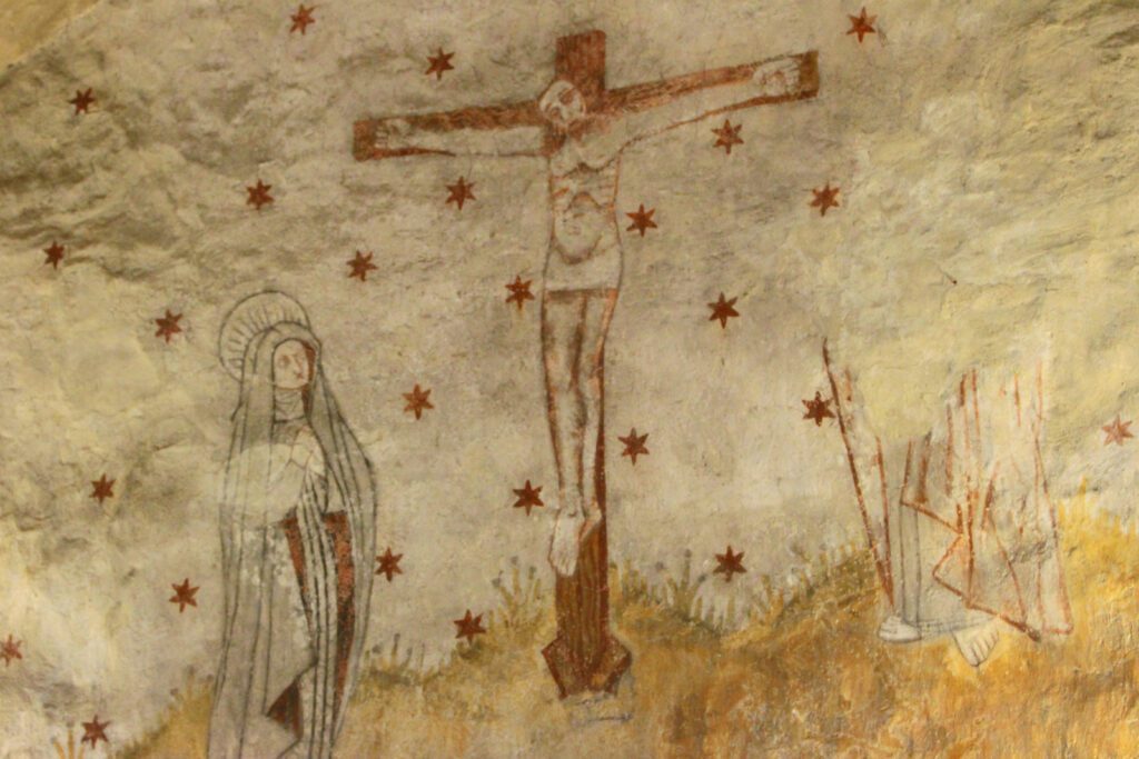 Rymättylän kirkon seinämaalauksia, jossa Jeesus ristillä.